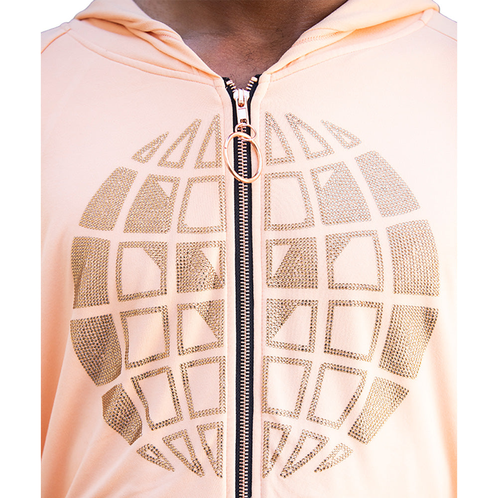 Blush pink Mariano zip hoodie with gold globe emblem and relaxed fit.