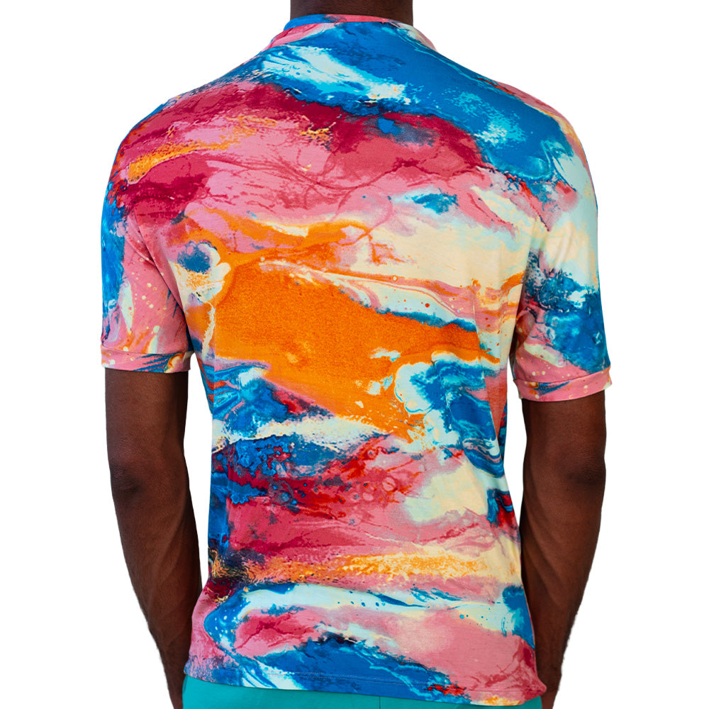Multicolor Mariano performance tee with watercolor print in blue, pink, and yellow tones.