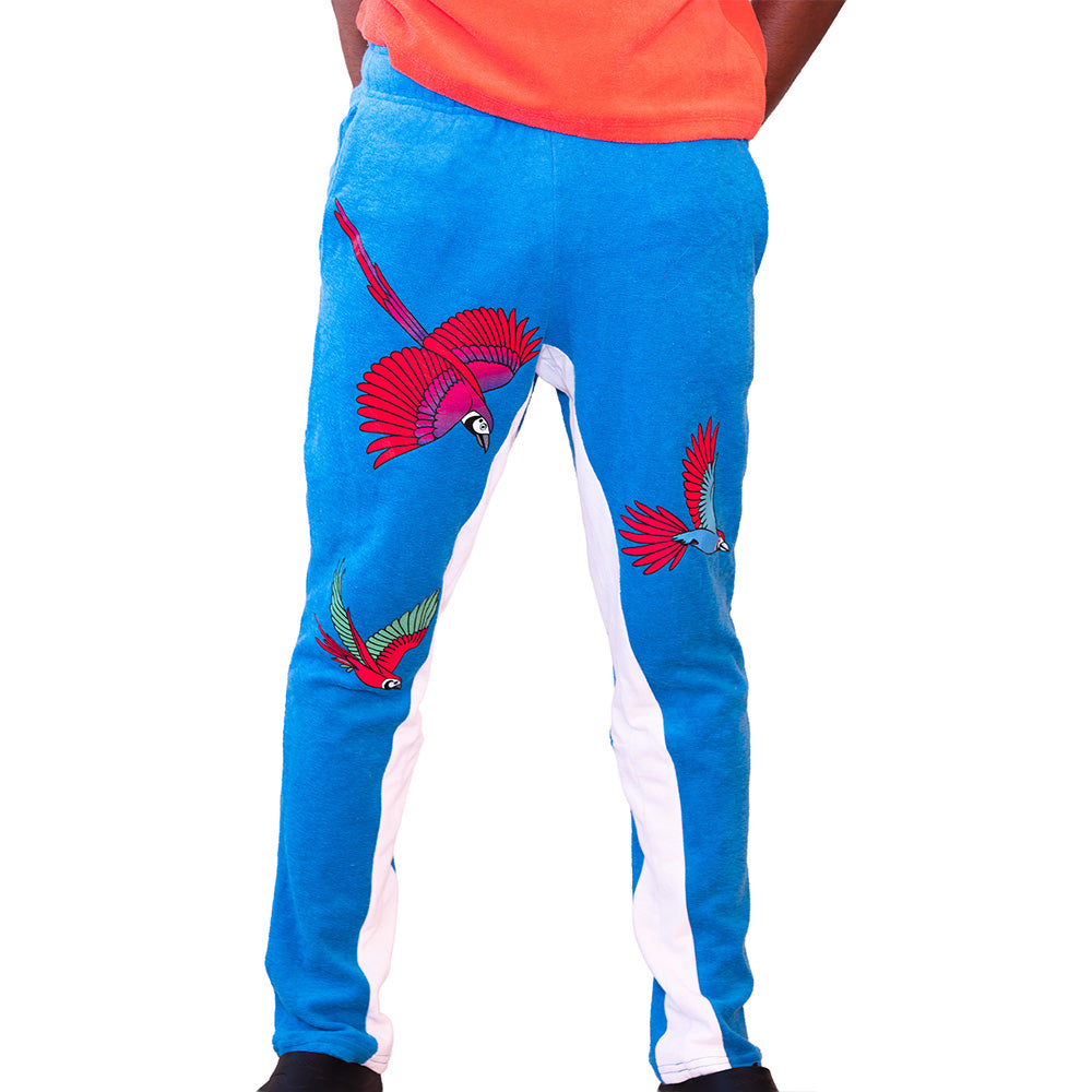 Blue Mariano track pants with red and blue bird prints and white side panels in a slim athletic fit