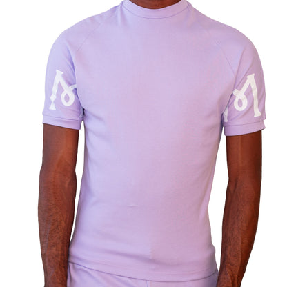 Lavender Mariano tee with white logo sleeves and minimalist crewneck design.
