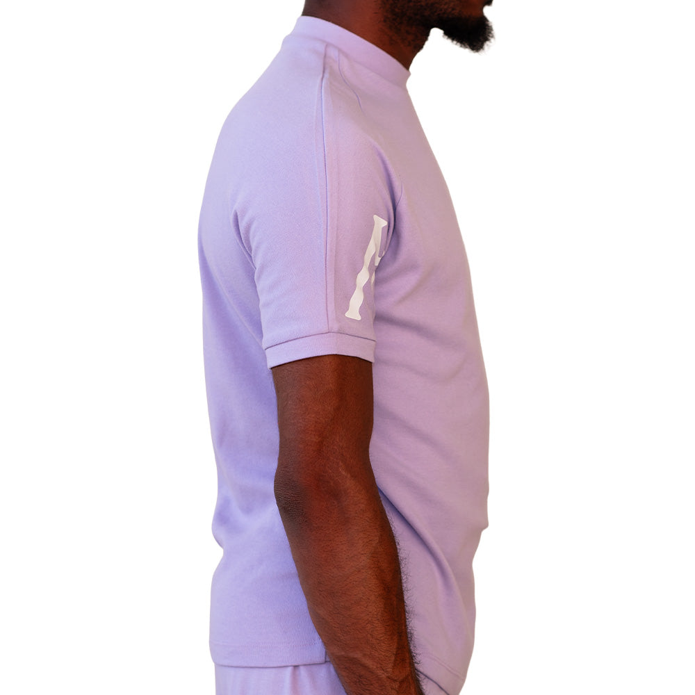 Lavender Mariano tee with white logo sleeves and minimalist crewneck design.