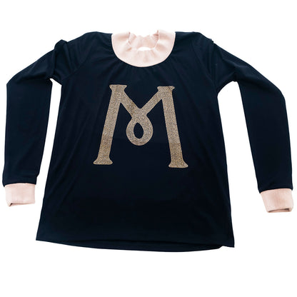 Black Mariano long-sleeve tee with gold ‘M’ logo and cream collar and cuffs