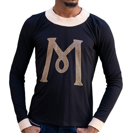 Black Mariano long-sleeve tee with gold ‘M’ logo and cream collar and cuffs