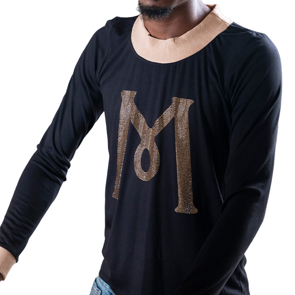 Black Mariano long-sleeve tee with gold ‘M’ logo and cream collar and cuffs