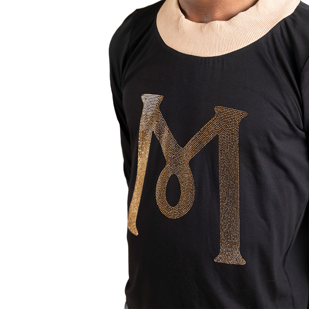 Black Mariano long-sleeve tee with gold ‘M’ logo and cream collar and cuffs