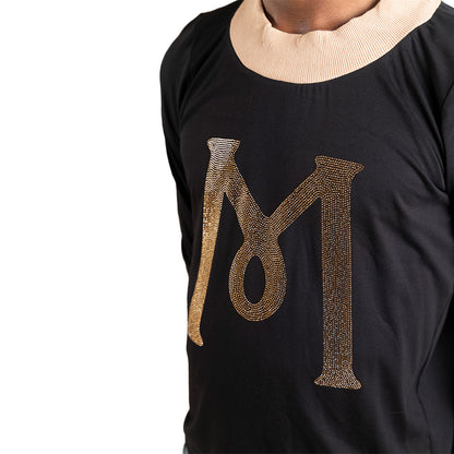 Black Mariano long-sleeve tee with gold ‘M’ logo and cream collar and cuffs