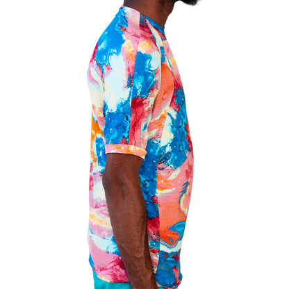 Multicolor Mariano performance tee with watercolor print in blue, pink, and yellow tones.