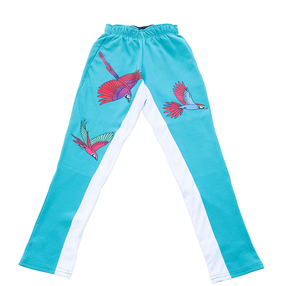 Turquoise Mariano track pants with red and blue bird prints and white side panels in a slim athletic fit.